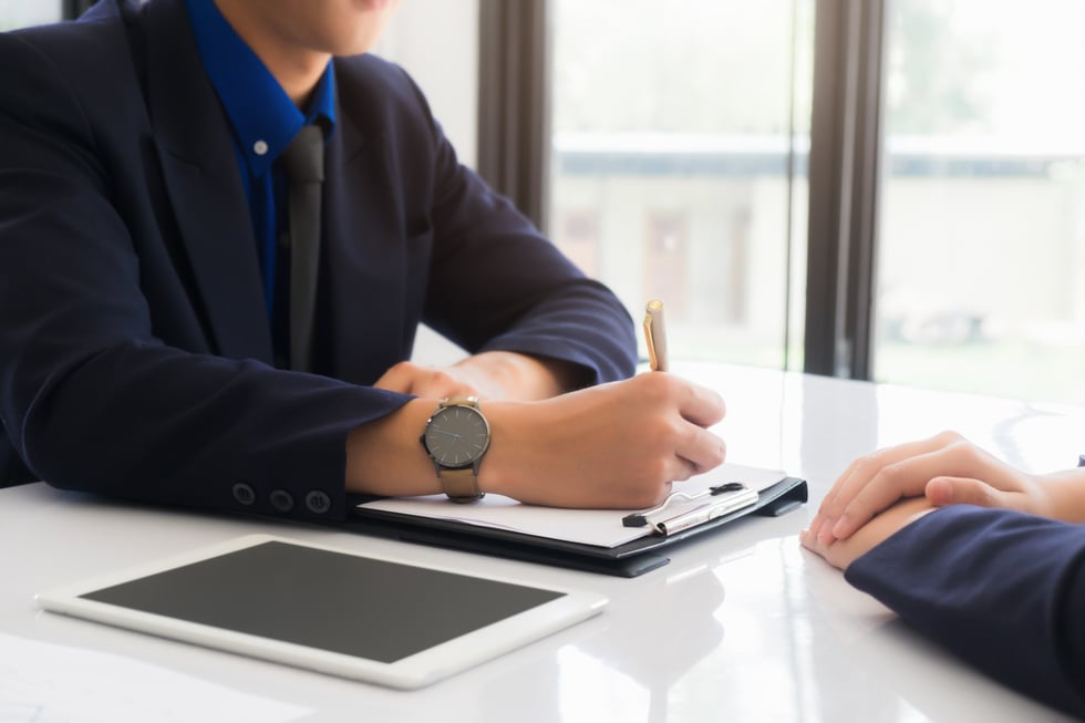 Close Up of Employer Interviewing an Employee